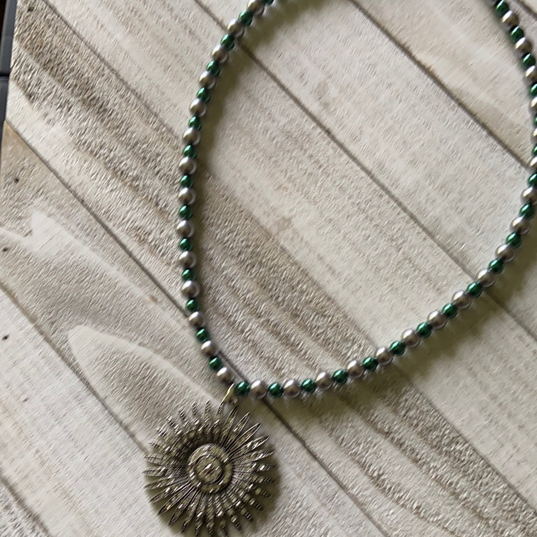 Green and gray beaded necklace with shiny pendant